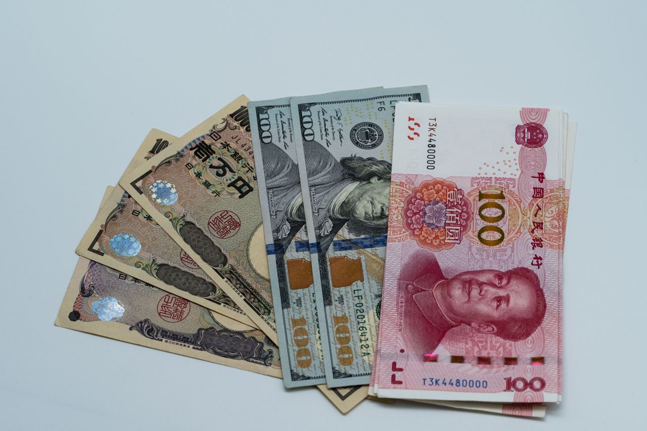Mastering the First Impression: Your intriguing post title goes here Various international currency notes including US dollars, yen, and yuan arranged on a surface.