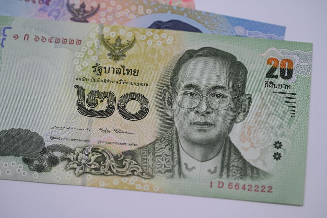 Services Detailed image of a 20 Thai Baht banknote highlighting traditional Thai design and currency features.